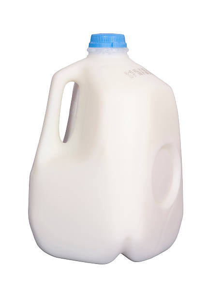 Gallon of skim milk with a hand written note on it.